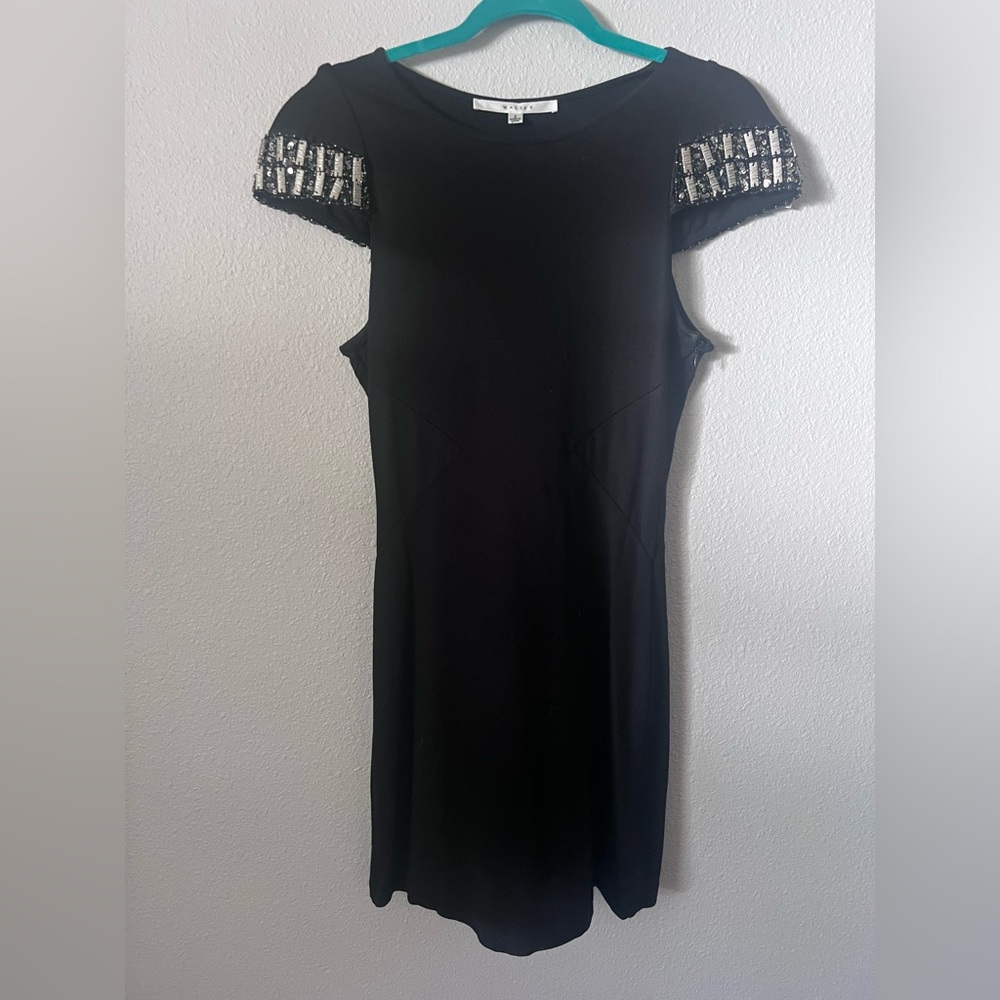 2000s Walter black knit dress with beaded cap sleeves. Size 2.